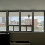 Window in the living room of an apartment, showcasing the view and design of the Bquiet soundproof glass.