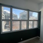 Window with Bquiet soundproof glass in a building, overlooking a neighboring construction site